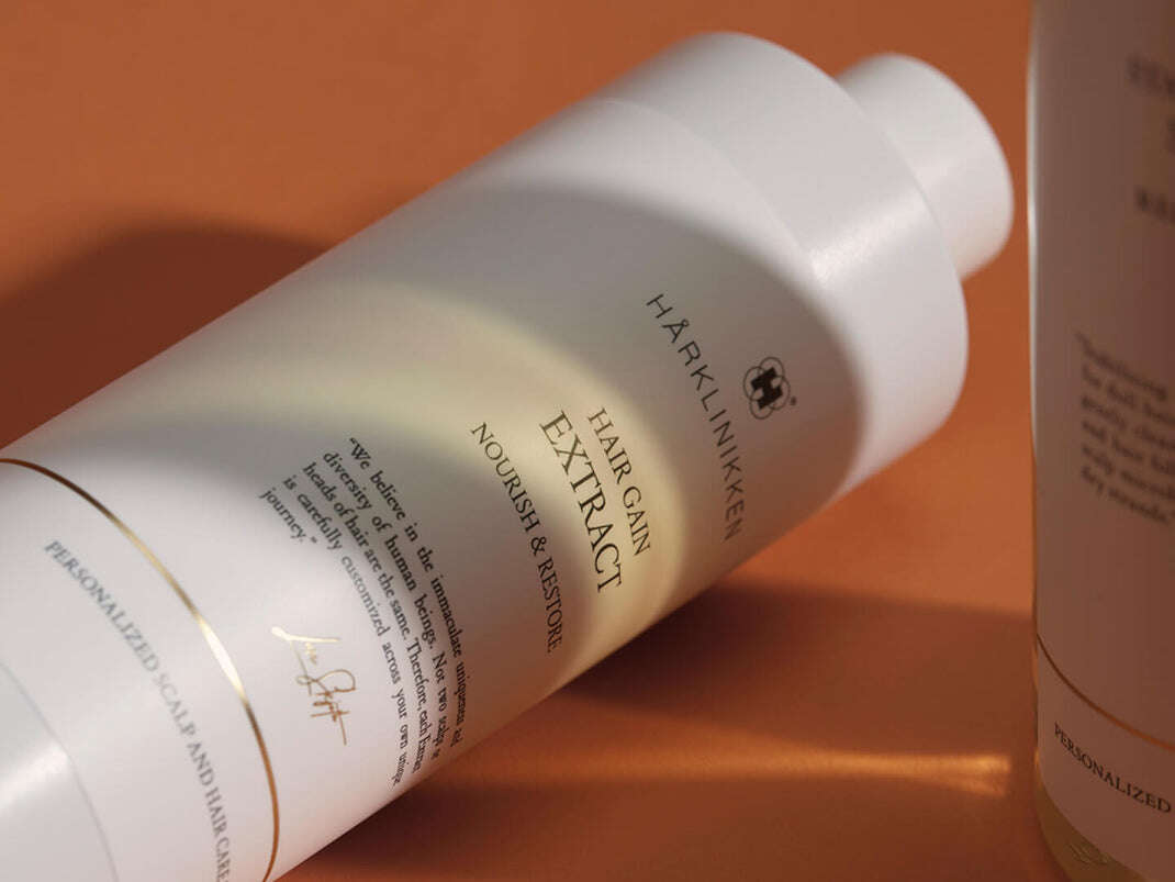 Hair_Gain_Extract_resting_on_orange_surface