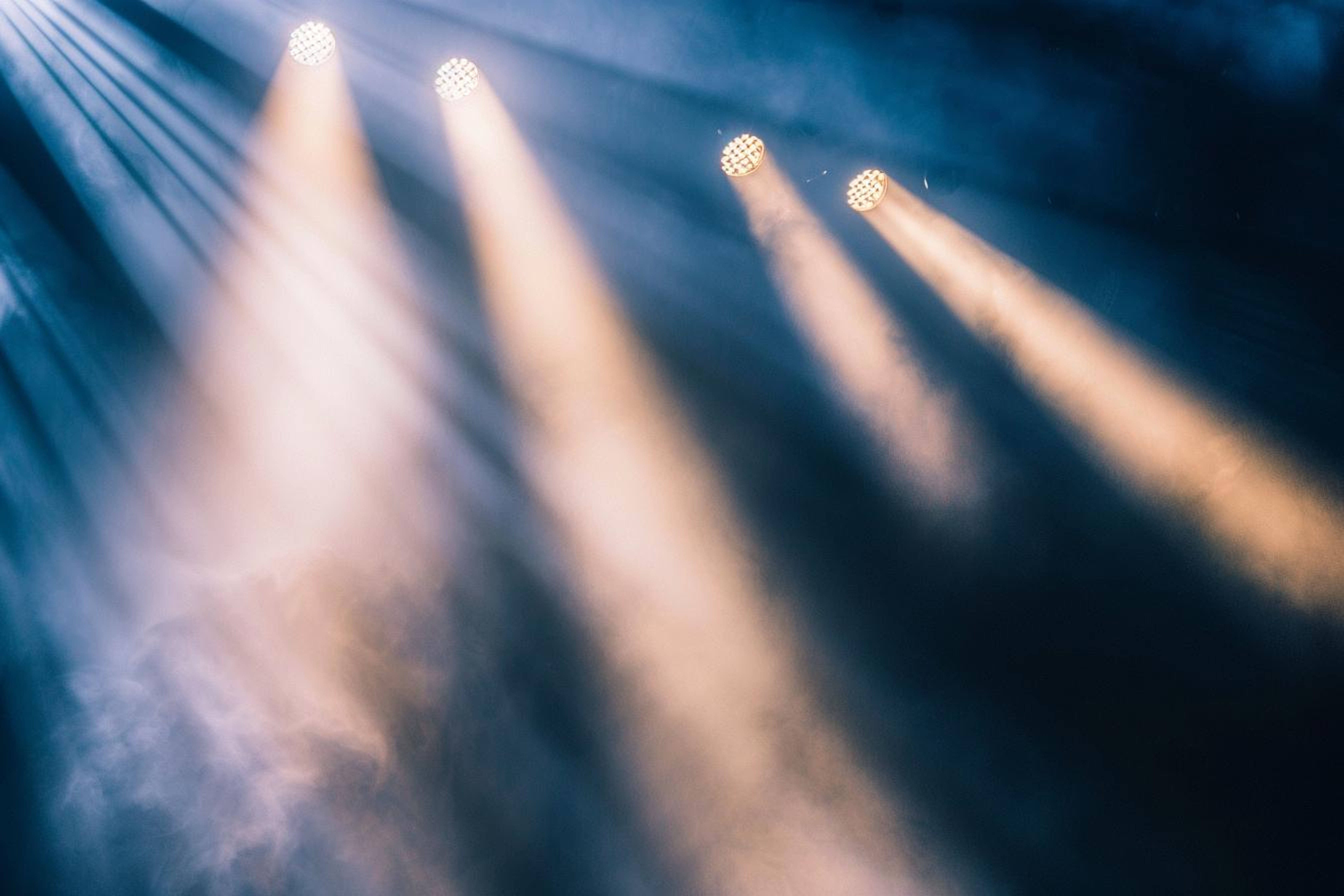 orange-blurred-beam-stage-light-dark-background